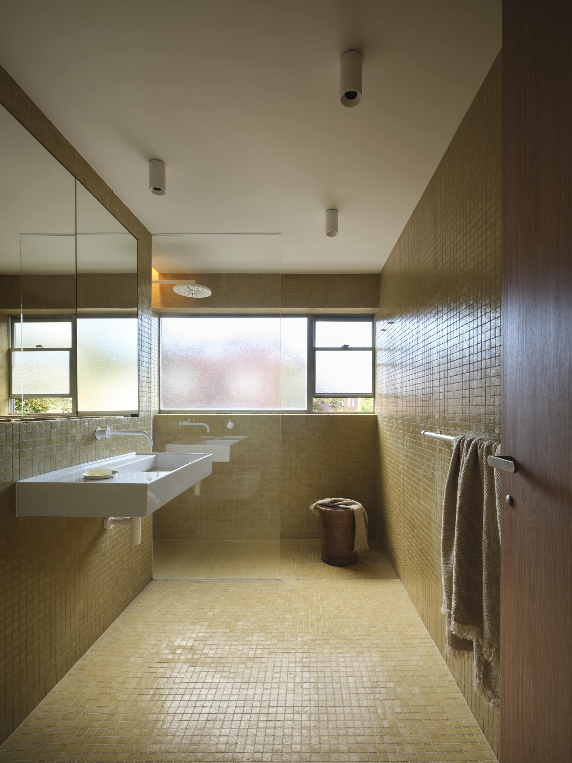 Ithaca Gardens — ochre tiled bathroom